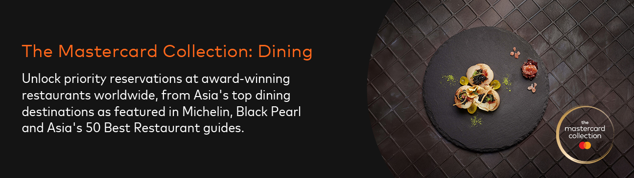 Promotional banner for The Mastercard Collection Dining featuring a gourmet scallop dish on a black slate plate