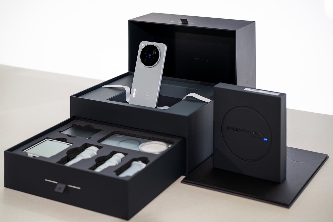 Unboxed black luxury collector edition case of the Vivo X500 Pro Max showcasing phone and external camera accessories